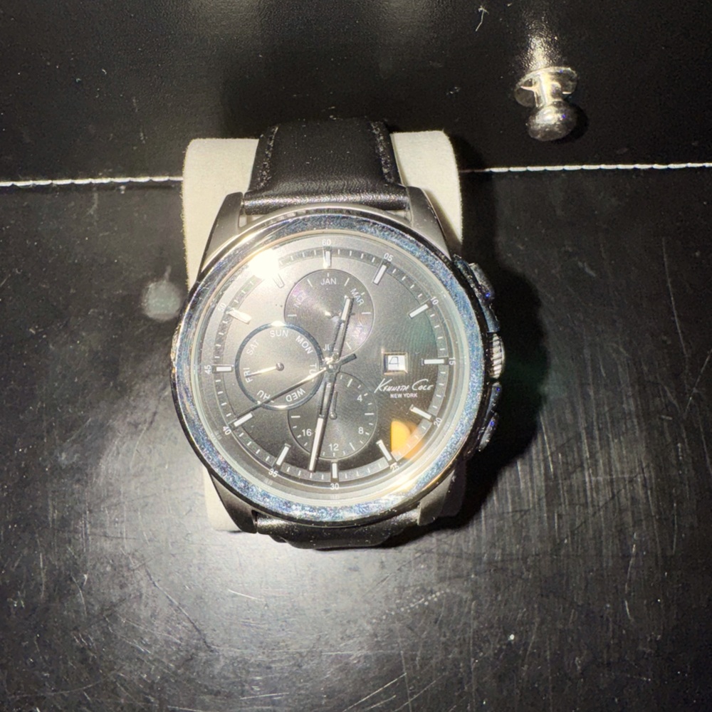 Kenneth Cole black leather watch.